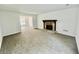 Bright living room with a stone fireplace, neutral paint and broad-loom carpeting at 5463 Forest East Ln, Stone Mountain, GA 30088