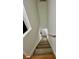 An inviting stairway with stained wood treads and white risers leads to the upper level of the home at 5463 Forest East Ln, Stone Mountain, GA 30088