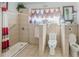 Bathroom with accessible shower, tile flooring and multiple toilets and sinks at 799 Moreland Se Ave, Atlanta, GA 30316