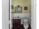 Modest half bathroom featuring a small sink and toilet at 799 Moreland Se Ave, Atlanta, GA 30316