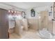 Bathroom with accessible shower, tile flooring and multiple toilets and sinks at 799 Moreland Se Ave, Atlanta, GA 30316