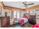 Modest bedroom featuring tiled floor, ceiling fan, accent wall, natural light and writing desk at 799 Moreland Se Ave, Atlanta, GA 30316