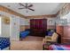 Bedroom with wood paneled walls featuring twin beds and coordinating armoires at 799 Moreland Se Ave, Atlanta, GA 30316