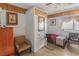 Serene bedroom with tiled floors, a single bed, an accent chair, and a classic wardrobe at 799 Moreland Se Ave, Atlanta, GA 30316