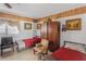 Bedroom featuring tiled flooring, twin beds, ceiling fan, and wood-paneled accent wall at 799 Moreland Se Ave, Atlanta, GA 30316