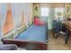 Cozy bedroom featuring a twin bed with wood floors and natural light streaming through blinds at 799 Moreland Se Ave, Atlanta, GA 30316