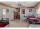 Modest bedroom with tile floor, single beds, sitting chair and view to dining area at 799 Moreland Se Ave, Atlanta, GA 30316