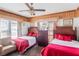Bedroom featuring tiled floor, twin beds, ceiling fan, accent wall, and natural light at 799 Moreland Se Ave, Atlanta, GA 30316