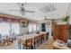 Spacious dining room features a long table, tiled floors, and ceiling fans for comfortable gatherings at 799 Moreland Se Ave, Atlanta, GA 30316