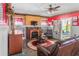 Comfortable living room with a fireplace, eclectic decor, and a vintage ambiance at 799 Moreland Se Ave, Atlanta, GA 30316