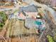 A beautiful aerial view of the property showcasing a large backyard with a pristine private pool at 1600 Spring Arbor Sw Ct, Lilburn, GA 30047