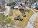 An aerial shot of a house with a meticulously landscaped lawn, circular driveway, and backyard pool at 1600 Spring Arbor Sw Ct, Lilburn, GA 30047