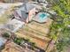 Aerial view of a property with a pool and large lawn, highlighting its well-manicured landscaping at 1600 Spring Arbor Sw Ct, Lilburn, GA 30047