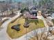 Aerial view of a home in a circular lot showcasing the property's extensive lawn and landscaping at 1600 Spring Arbor Sw Ct, Lilburn, GA 30047