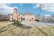 A spacious backyard featuring a patio, in-ground pool with slide, and lush greenery for outdoor enjoyment at 1600 Spring Arbor Sw Ct, Lilburn, GA 30047