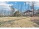 Expansive backyard with a well-maintained lawn, black fencing, and in-ground pool, perfect for recreation at 1600 Spring Arbor Sw Ct, Lilburn, GA 30047