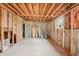 Unfinished basement with concrete floor and wooden beams; ready for customizations at 1600 Spring Arbor Sw Ct, Lilburn, GA 30047
