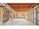 Spacious unfinished basement with concrete floors and wooden beam infrastructure at 1600 Spring Arbor Sw Ct, Lilburn, GA 30047