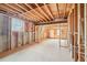 Unfinished basement ready to be customized; features concrete floors and wooden beams at 1600 Spring Arbor Sw Ct, Lilburn, GA 30047
