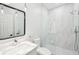 Modern bathroom with glass-enclosed shower, white marble tile, and sleek fixtures at 1600 Spring Arbor Sw Ct, Lilburn, GA 30047