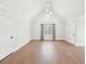 Spacious bedroom features vaulted ceilings, recessed lights, and wood floors at 1600 Spring Arbor Sw Ct, Lilburn, GA 30047