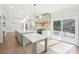 Sunlit kitchen with an extended island, stainless steel appliances, and easy access to the outdoor patio at 1600 Spring Arbor Sw Ct, Lilburn, GA 30047