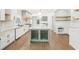 Spacious kitchen featuring custom cabinetry, large island, and hardwood floors for a welcoming feel at 1600 Spring Arbor Sw Ct, Lilburn, GA 30047