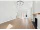 Spacious living area with fireplace and bright, neutral color palette for versatile decor options at 1600 Spring Arbor Sw Ct, Lilburn, GA 30047