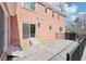 Outdoor patio with brick exterior and sliding door, leading to an outdoor entertaining space at 1600 Spring Arbor Sw Ct, Lilburn, GA 30047