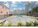Beautiful in-ground pool with a slide, set in a backyard surrounded by lush landscaping and privacy fencing at 1600 Spring Arbor Sw Ct, Lilburn, GA 30047