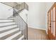 Elegant staircase features dark iron railings and wood treads, leading to an open landing at 1600 Spring Arbor Sw Ct, Lilburn, GA 30047
