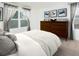 Cozy main bedroom with a large window, dresser, and tranquil decor with curtains at 202 Gillis Way, Villa Rica, GA 30180