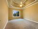 Bedroom with tray ceiling and carpeting at 6111 Sequoia Ln, Douglasville, GA 30135