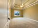 Bedroom with tray ceiling and large window at 6111 Sequoia Ln, Douglasville, GA 30135