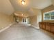 Bonus room with tray ceiling, carpeting, wet bar, and recessed lighting at 6111 Sequoia Ln, Douglasville, GA 30135