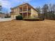 Lovely home with a spacious yard, covered porch, and deck perfect for outdoor enjoyment and entertaining at 6111 Sequoia Ln, Douglasville, GA 30135