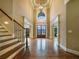 Elegant foyer with hardwood floors, staircase, high ceilings, and grand chandelier at 6111 Sequoia Ln, Douglasville, GA 30135