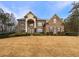 Stunning two-story brick home with a manicured lawn and beautiful landscaping at 6111 Sequoia Ln, Douglasville, GA 30135