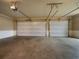 Spacious two-car garage with two doors, ample ceiling height, and ready for all your storage needs at 6111 Sequoia Ln, Douglasville, GA 30135