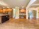 Open kitchen with stainless steel appliances and natural wood cabinets at 6111 Sequoia Ln, Douglasville, GA 30135
