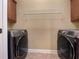 Spacious laundry room with side-by-side washer and dryer at 6111 Sequoia Ln, Douglasville, GA 30135