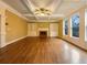 Bright living room featuring a fireplace, built-in shelving and large windows at 6111 Sequoia Ln, Douglasville, GA 30135