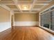 Living room with coffered ceilings, wainscoting, and hardwood floors at 6111 Sequoia Ln, Douglasville, GA 30135