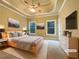 Staged main bedroom with tray ceilings, ample natural light, and tasteful decor at 6111 Sequoia Ln, Douglasville, GA 30135