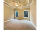 Serene main bedroom with tray ceilings and natural light from large windows at 6111 Sequoia Ln, Douglasville, GA 30135