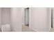 Upstairs hallway with access to bedrooms and bathrooms, all neutrally painted for a bright and airy feel at 436 Reflection Dr # 15, Stockbridge, GA 30281