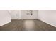 Bright living room features wood flooring, white walls, and a large window for ample natural light at 436 Reflection Dr # 15, Stockbridge, GA 30281