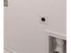 This shot shows the blank white wall with an outlet, pipe connection, and dryer vent hookup at 436 Reflection Dr # 15, Stockbridge, GA 30281