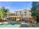 Beautiful backyard featuring a pool, a spa, a pergola, a patio, and a covered deck offering outdoor living spaces at 5120 Parkwood Oaks Ln, Smyrna, GA 30126