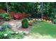 Beautiful backyard with lush greenery, trampoline and a chair at 5120 Parkwood Oaks Ln, Smyrna, GA 30126